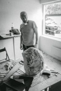 Rob MacDonald looking at his sculpture photo by Futuro Berg